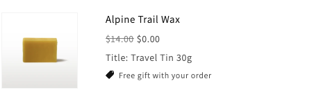 A Shopify cart line for Alpine Trail Wax showing $14.00 struck through beside $0.00, tagged "Free gift with your order".
